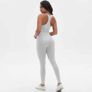 Close-up of light grey seamless yoga set showing high-waist fit and racerback sports bra