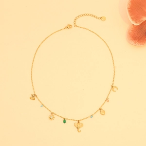 Gold charm necklace with cherry, elephant, and crescent moon on double-layer steel chains