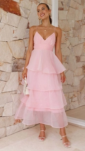 Full view of pink layered ruffle cake dress with spaghetti straps and tulle texture