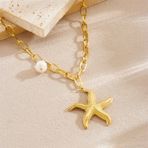 Gold starfish pendant necklace with pearl charm on polished stainless steel chain
