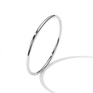 Minimalist 3mm polished silver steel bangle bracelet standing on a clean white background