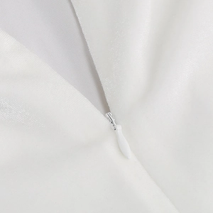 Close-up of the high-quality white invisible zipper and smooth velvet fabric texture