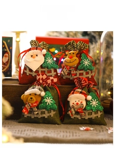Detailed view of four 3D Christmas drawstring gift bags with cartoon 3D plush characters