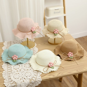Girls wide brim straw sun hats with floral decor and lace edges in five pastel colors