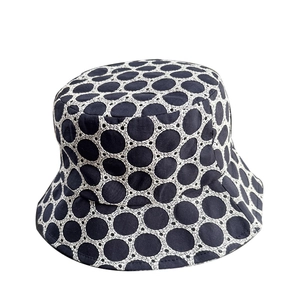Navy blue summer bucket hat with white circular lace embroidery and breathable fabric