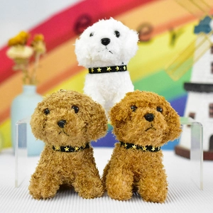 Detailed view of white and brown teddy dog plush toy pendants with star collars