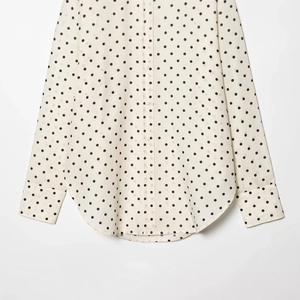 Women's vintage polka dot button-up long shirt with lapel and curved hemline