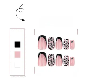 Detail view of square fake nails with heart patterns, rhinestones, and French tips
