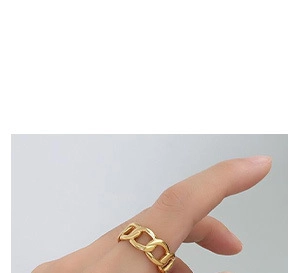 Detailed view of French vintage gold cuban link wave ring on model hand