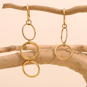 Detailed shot of 18K gold-plated four-layer interlocking rings with pave diamonds