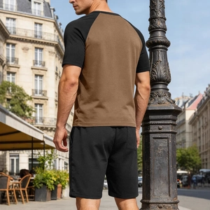 Men's two-piece summer casual set with color-block raglan tee and black shorts outdoor