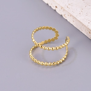 Detailed view of adjustable golden hollow double row ring with textured bead design