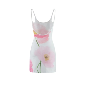 Detail of floral printed summer dress with thin straps and deep U-neckline on white background