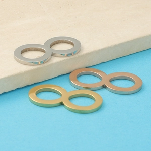 Polished infinity symbol pendants in silver, gold, and rose gold finishes