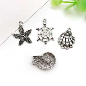 Silver alloy ocean jewelry charms set featuring starfish turtle shell and conch for DIY