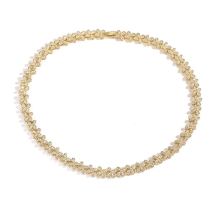 Close-up of gold-plated clover necklace with colorful sparkling cubic zirconia accents
