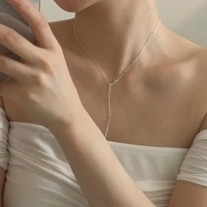 Close-up of S925 sterling silver beads pig nose necklace on model neck in mirror