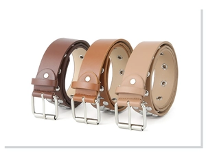 Detailed view of rolled PU leather belts in dark brown, camel, and beige with metal studs