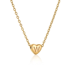 Macro shot of 18K gold plated heart pendant with letter W engraving on delicate O-chain