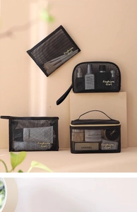 Detail of four black mesh makeup bags with gold 'Fashion Girl' text and zipper