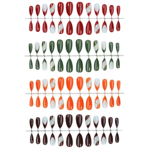 Almond-shaped press-on nail sets in red, green, and orange with gold line art accents