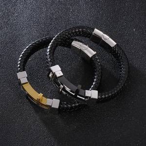 Braided leather bracelet for men featuring a cross charm and magnetic metal clasps