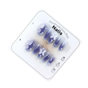 Handmade gradient purple press-on nails with 3D white butterfly and pearl accents