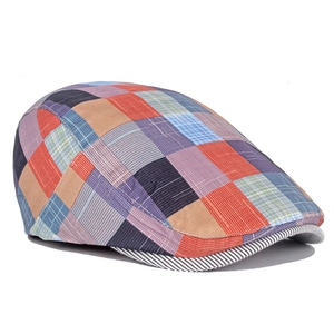 Close-up of colorful checkered flat cap showing breathable cotton fabric texture
