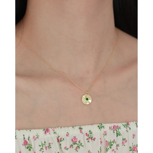 Retro S925 silver necklace featuring a star-etched round pendant with green emerald stone