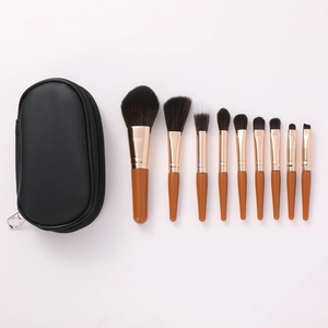 9pcs mini travel makeup brush set with brown wooden handles and black zipper pouch