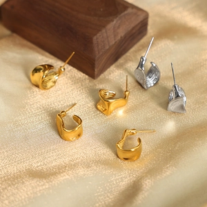 Irregular wave earrings in gold and silver finish with minimalist lava style design