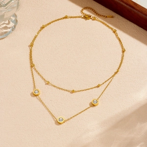 Double-layer gold stainless steel necklace with Roman numeral pendants and crystal accents