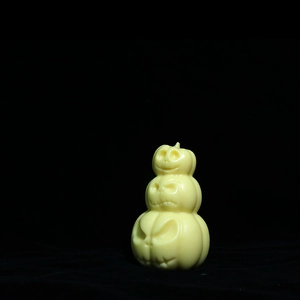 Detailed view of stacked Halloween pumpkin silicone mold with expressive faces