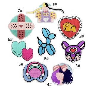 Detailed view of colorful embroidered patches featuring cute cartoon animal designs