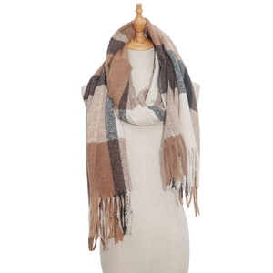Close-up of thick plaid shawl scarf with soft fringes in brown and beige tones