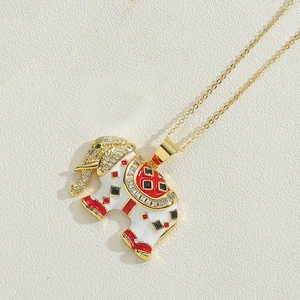 Macro detail of elephant pendant with 14K gold plating, enamel, and zircon inlays