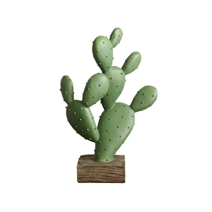 Nordic resin cactus decor in matte green with textured needles on a wooden base