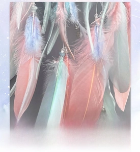 Detail of soft dreamcatcher feathers with crystal beads and high-temperature fumigation