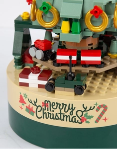Detail of Christmas tree building block music box with mini train and Merry Christmas text