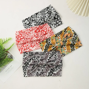 Set of four stylish knotted floral and leopard print wide headbands for women's yoga