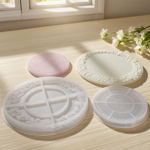 Detail of floral embossed round plate resin molds with pink and white finished samples