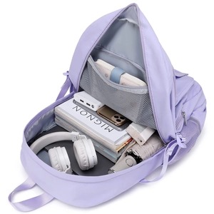 Internal view of purple school backpack showing large capacity for laptop and books