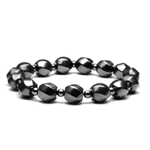 Macro detail of men's bracelet with faceted hematite beads and metallic spacers