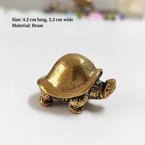 Detailed close-up of a small brass dragon turtle figurine measuring 4.2cm by 2.5cm
