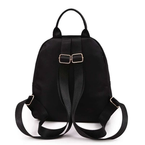 Rear view detail of the black waterproof nylon backpack showing adjustable straps