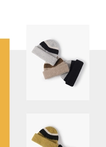 Detail view of thick striped wool knit beanies in gray, beige, and mustard yellow colors