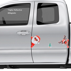 Close-up of highly reflective magnetic Christmas stickers featuring Santa on a car door
