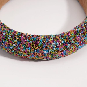 Close-up detail of Baroque headband featuring colorful crushed gemstones and beads