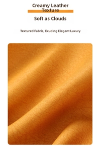 Close-up of orange faux leather texture showing soft cream-like grain for sunglasses pouch