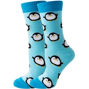 Detail shot of mid-calf socks featuring blue cartoon penguin patterns with reinforced heels